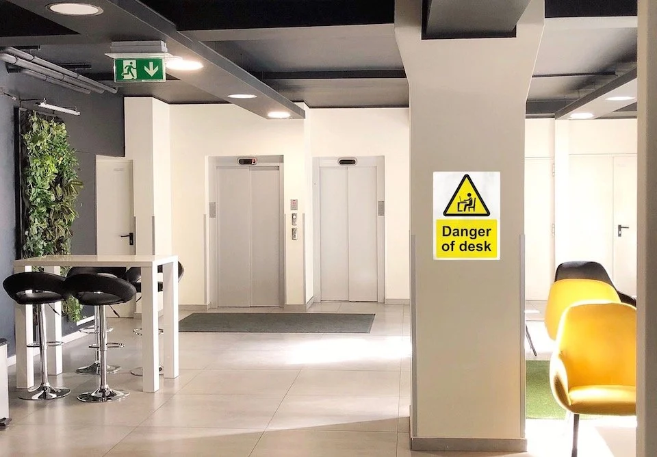 danger of desk office 'Danger of Desk' sign in office